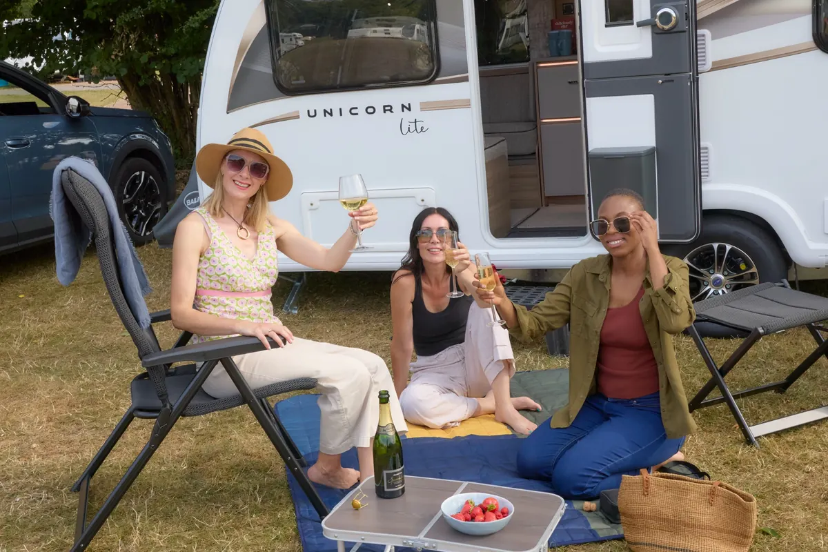 Outdoor living beside a Bailey Unicorn Lite caravan